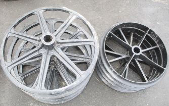 Two sets of Shepherd Hut cast iron wheels. Four spoke, 61cm. Seven spoke 67cm