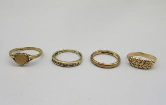 9ct yellow gold heart ring, size P1/2, two other 9ct gold rings, both stamped 375, and a yellow