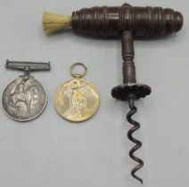 Late C19th/early C20th mahogany handled corkscrew with bristle end, of turned barrel form with steel