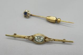 10ct yellow gold bar brooch set with pale blue stone, and a yellow metal tie pin with 14ct white