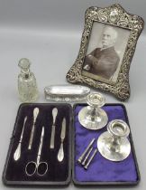 Collection of table silverware incl. Edwardian silver decorative repousse picture frame, cherub