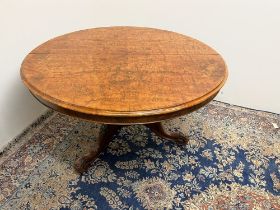 Victorian figured walnut breakfast table, circular top on carved column and three cabriole legs,