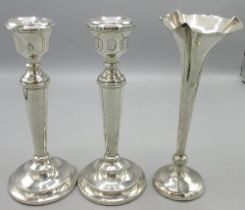 Pair of 20th century silver candle sticks with tapered centre and circular weighted bases with