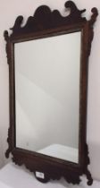 Geo. 111 style mahogany fretwork wall mirror, upright plate in gilt slip, H66cm