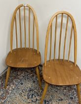 Two Ercol Quaker stick back dining chairs, H95cm, both with gold sticker