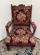 Edwardian upholstered open arm chair, on turned supports