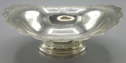 20th century silver bon bon dish with crimped wavey edge embossed with flower heads, and stepped