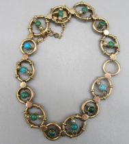 9ct yellow gold bracelet set with blue and green stones and seed pearls (two pearls missing), with