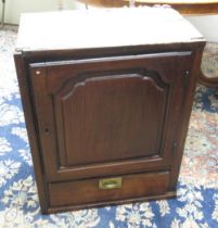 C18th and later oak wall cupboard, fielded arched panel door above a drawer, W57cm D33cm H73cm