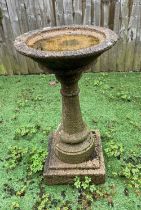A reconstituted stone bird bath on plinth and stand, height 83cm high, bath diameter 46cm