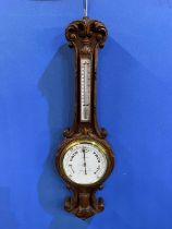 C20th carved oak cased Negretti & Zambra Aneroid barometer and thermometer, No.27238, H91cm