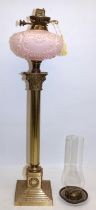 Early C20th brass Corinthian column oil lamp on stepped base, moulded pink opaline glass