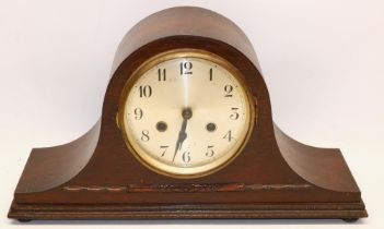 1930's continental oak striking mantel clock, brass bezel enclosing 5 1/2" silvered Arabic dial, two