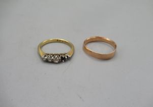 9ct yellow wedding band, stamped 375, size N, 1.3g, and an 18ct yellow gold ring set with 3