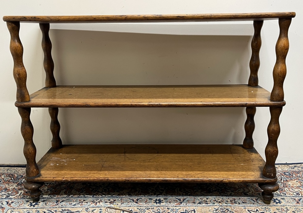 Victorian golden oak three tier buffet, on turned supports, W107dm D35cm H78cm