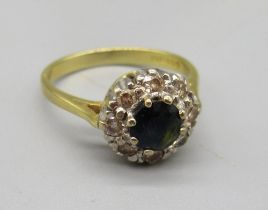18ct yellow gold cluster ring set with central sapphire surrounded by diamonds, stamped 750, size N,