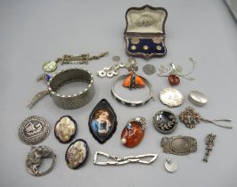 Jet pendant with portrait centre, two Japanese Satsuma porcelain enamel brooches, a collection of