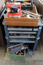 Tool trolly containing a large selection of drills, spanners etc