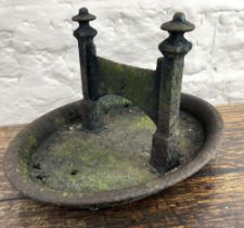 Black painted cast iron boot scraper on oval base, L35cm