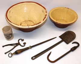 Terracotta bread pancheon with glazed interior D39cm , with a smaller example D27cm , pair of iron