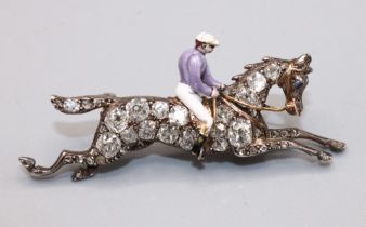 Victorian diamond-set horse and jockey brooch, the enamel jockey riding a white and yellow metal