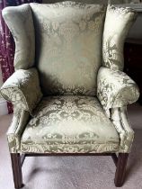 George III Chippendale style upholstered armchair, serpentine outsplayed wingback and arms on