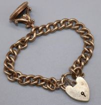 9ct yellow gold curb link bracelet with heart shaped padlock closure and safety chain, with attached