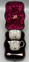 Victorian silver milk and sugar set, part lobed and repousse decorated with flowers and scrolls,