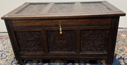 Small 18th century and later oak coffer, hinged top and front with three geometric and floral carved