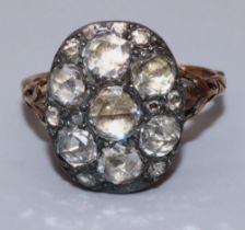 C18th yellow and white metal diamond cluster ring set with seven large old cut diamonds amongst