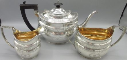 Early 20th century George 111 style silver three piece tea service, ovoid bodies bright cut and