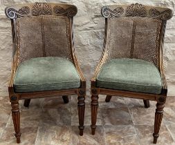 Pair of Regency rosewood library chairs, the shaped curved back with lobed and scroll carved