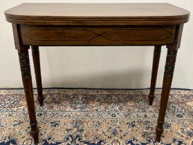 Regency mahogany D shaped tea table, with ebonised stringing and detail, folding top on twin gate