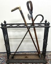 Early 20th century painted cast iron rectangular six division stick stand, floral and rosette cast