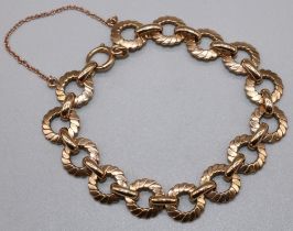 C1970s 9ct yellow gold fancy link bracelet with safety chain, stamped 375, 18.14g