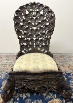 19th century Eastern hardwood nursing chair, curved back and frieze pierced and carved with