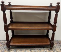 William 1V mahogany buffet, three rectangular tiers on lobed tapering supports with similar finials,