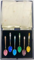 Set of six 20th century silver gilt and enamel coffee spoons, decorated in colours with shell