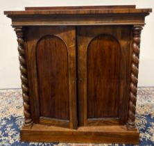 Victorian rosewood Chiffonier, raised back and plain frieze above two arched panel doors enclosed by