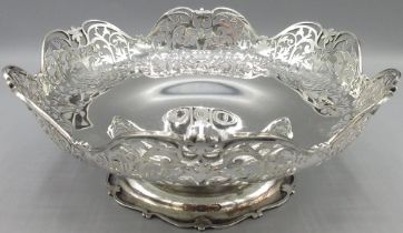 George V silver circular fruit bowl, with scroll and leaf pierced waived border on scroll cast base,