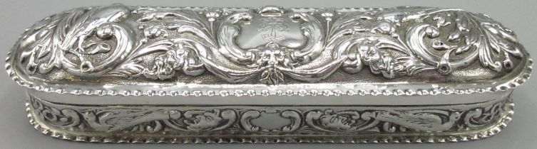 Victorian silver rounded rectangular dressing table box, all over repousse with birds scrolls and