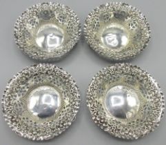 Pair of late Victorian silver circular bon-bon dishes, with geometric pierced sides and repousse