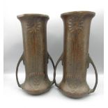Pair of Art Nouveau hammered copper vases, cylindrical bodies decorated with stylised foliage and