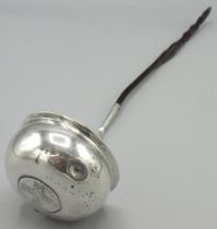 Antique unmarked white metal Toddy ladle, shaped bowl inset with a 1777 hammered silver coin, on