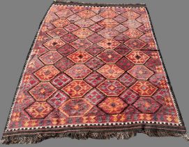 20th century Kilim multi-coloured wool rug, central field with hexagonal repeating medallions,