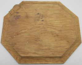 Robert Mouseman Thompson of Kilburn - an oak octagonal bread board with with carved signature mouse,