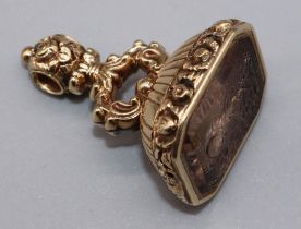 Victorian yellow metal fob seal set with quartz intaglio with carved foliage detail, 21.00g