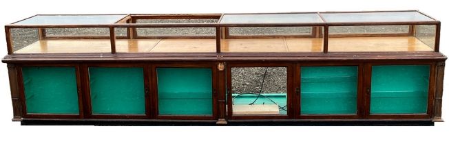 Large 20th century oak shop display cabinet with glazed top and front above six glazed doors,
