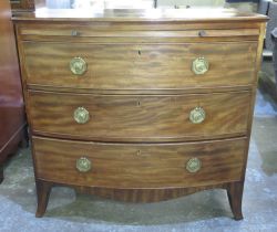 Geo. IV mahogany bow front dressing chest with brushing slide and three long drawers on bracket
