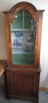 Queen Anne style walnut arched top side cabinet, with glazed upper and panel lower doors on